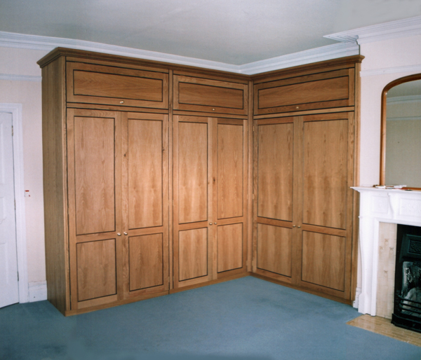 Bespoke Wardrobes in Oak with American Black Walnut Beading