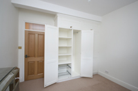 Fitted Wardrobes with Shoe Rack, Pigeon Holes and Top Boxes, showing Pull-Out Shoe Rack. Click for Enlargement 2 (0.6 mb).