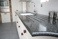 Integrated Draining Board in 'Volcanics' Acrylic-Stone work-surface. Enlargement 2.   (0.6 mb).