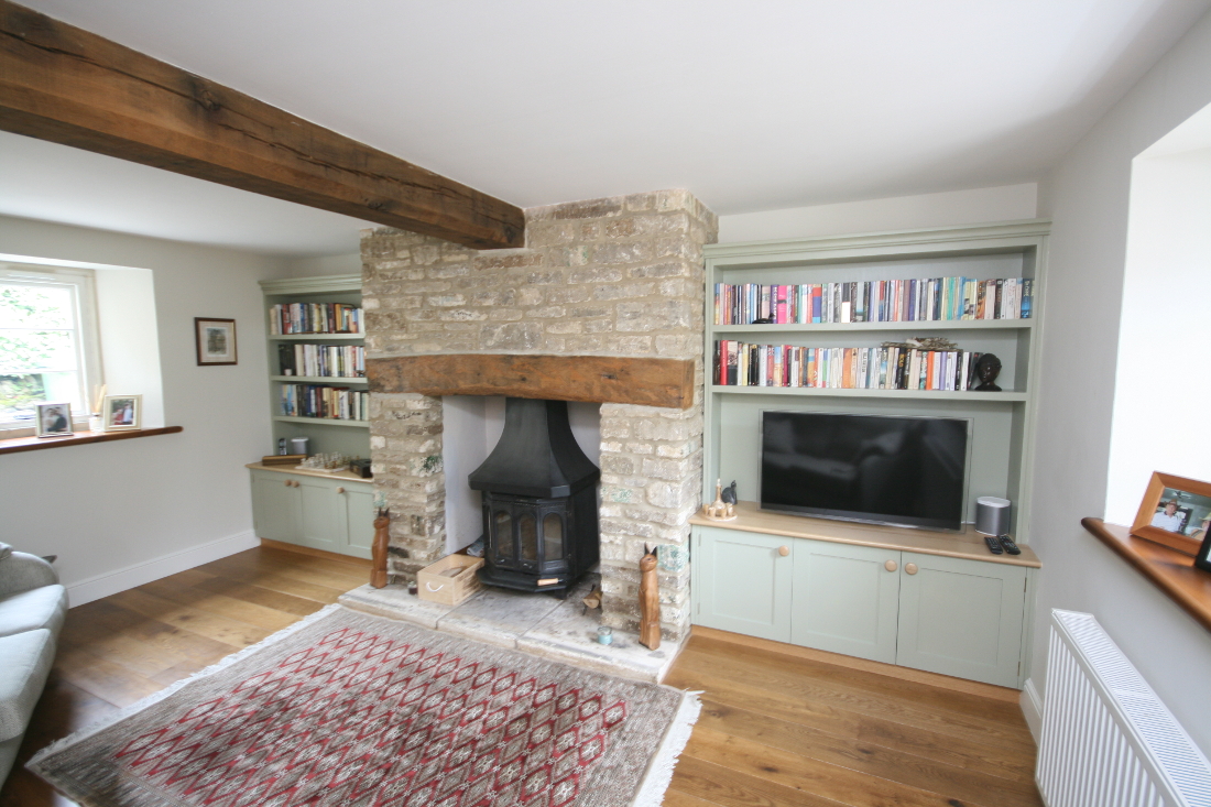 Alcove Units with Bookshelves Cupboards, Oak Worktop and TV surrounding fireplace in South Gloucestershire. Click for Enlargement 1 (0.6 mb)