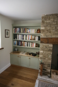 Alcove Units with Bookshelves Cupboards, Oak Worktop and TV surrounding fireplace in Gloucestershire. Click for Enlargement 2