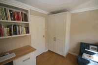 Bespoke hand painted office with oak desk, Showing Desk and Wardrobe.